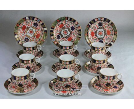 Crown Derby imari pattern, set of nine cups and saucers, three tea plates.