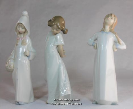 Lladro figure of girl in night clothes; two Nao figures of children (3)