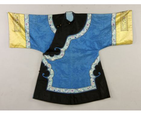 Chinese Qing dynasty men's winter robe, light blue, with yellow embroidered cuffs and gilt buttons, 39" l. Provenance: from a