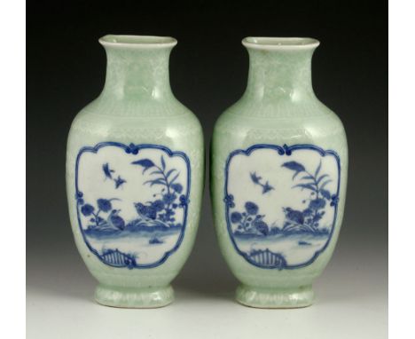Two late Qing dynasty wall vases, blue and white under light green glazed, decorated with flower and bird scene, Qing Qianlon