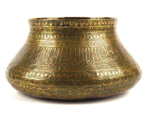 A brass basin, presumably emulating a Mamluk original from Egypt or Syria; the shoulder with a band of Thuluth [or other] ins