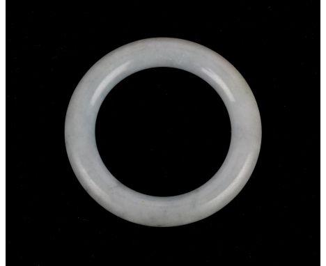 A jadeite bangle of typical, circular form; just over 7cm diameter; the inside roughly 5cm diameterCondition Report:  No easi