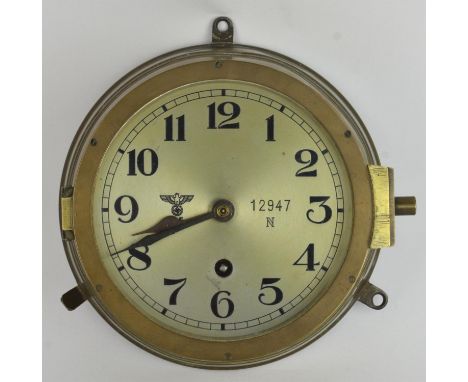 Third Reich period Kriegsmarine U-boat clock. The silvered brass dial with Arabic numerals is numbered 12947N with an eagle a