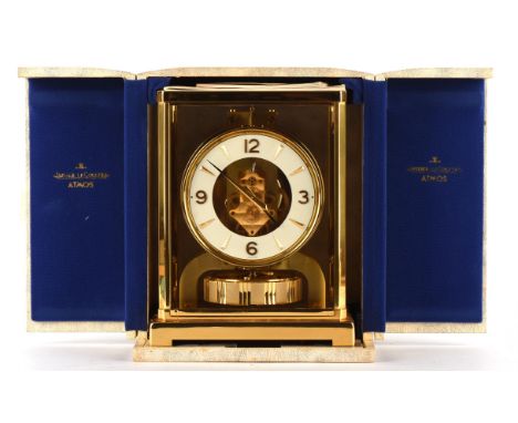 A late 20thC Jaeger-le-Coultre 'Atmos Classic V' table clock, the brass dial with white chapter ring bearing Arabic numerals 