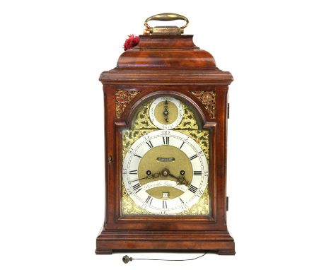 A George III mahogany mantel clock by Percival Mann, London, the case with domed top and brass carrying handle, with glazed d