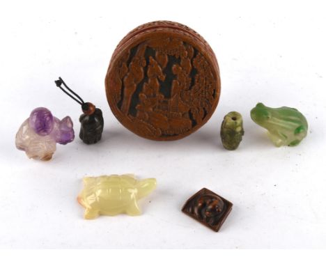 A  Japanese wood netsuke of a recumbent puppy, unsigned; together with an amethyst carving of a figure, a glass figure of a f