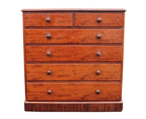 A large Victorian mahogany chest of drawers, with rounded corners and two short and four long graduated drawers, back panelle