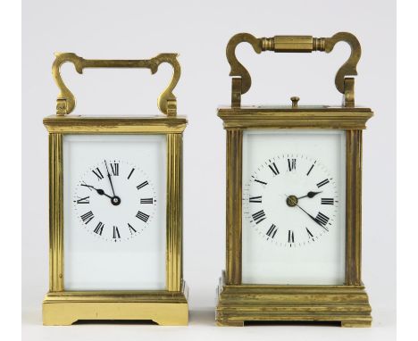 A brass carriage clock, the white enamel dial with Roman numeral chapter ring, twin train brass movement with gong strike and