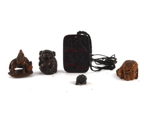 Three Japanese wood netsuke, comprising: one with single himotoshi of a Chinese Scholar seated on a water buffalo; one of a K