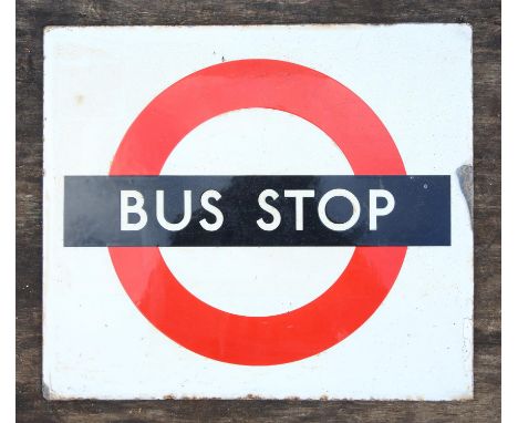 An enamel bus stop sign, probably late 20th century, 39 cm x 44.5 cm, together with four bus conductors ticket sales machines