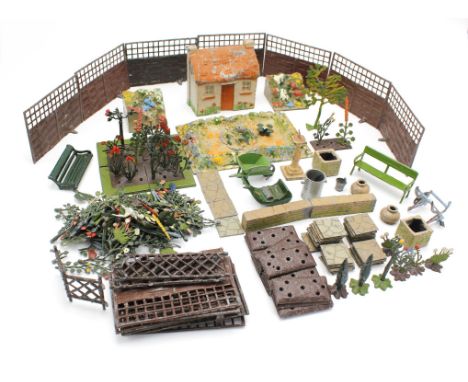 A quantity of pre-war Britain's hollow cast lead Garden items including, various flower beds, trellis fences, flowers, lawn m