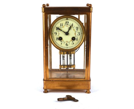 A Richard & Co. French brass four glass clock with mercury compensating pendulum, white enamel dial and two train movement st