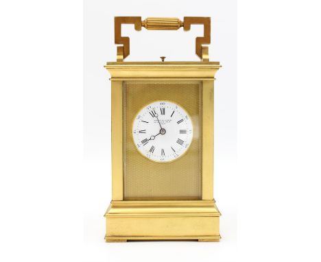 A French carriage clock, with architectural case, the white enamel dial with roman and Arabic numeral chapter ring, bearing r