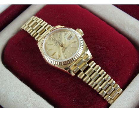 A Lady's 18ct gold Rolex Oyster Perpetual Datejust bracelet wristwatch, the gold dial with gold batons, date aperture and swe