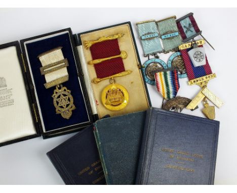 A collection of Masonic ephemera, comprising; a 9ct gold jewel dated 1931 with three 9ct gold clasps to ribbon and engraved t