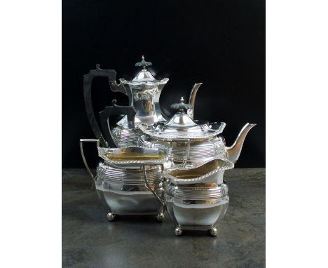 A matched Edwardian four piece silver tea and coffee service, Walker & Hall, Sheffield 1903 & 1904 and Chester 1906, each pie