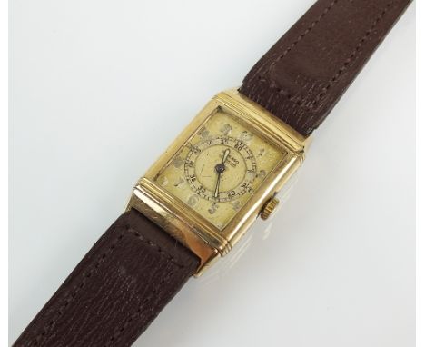 A 9ct gold Le Coultre Reverso wristwatch, the oblong dial with Arabic numerals, the large inner dial with luminous hands, man