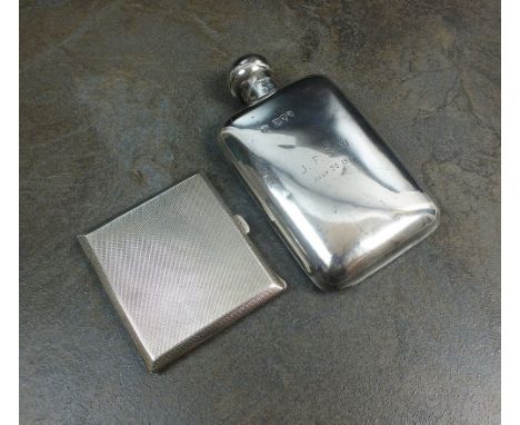 A Victorian silver hip flask, London 1893, with engraved inscription, 14.3cm high, together with an engine turned silver ciga