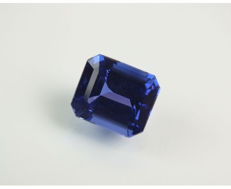 An unmounted octagon step cut tanzanite, with certificate stating weight of 8.84cts ***