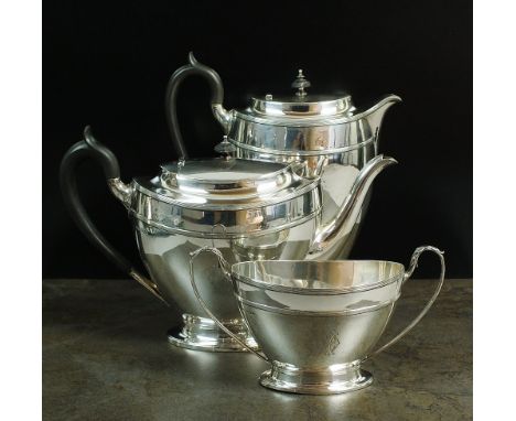 An Edwardian three piece silver tea service, James Dixon & Sons Ltd, Sheffield 1908, each piece of tapering navette form with