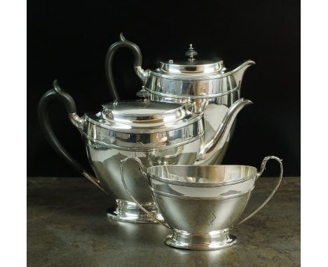 An Edwardian three piece silver tea service, James Dixon & Sons Ltd, Sheffield 1908, each piece of tapering navette form with