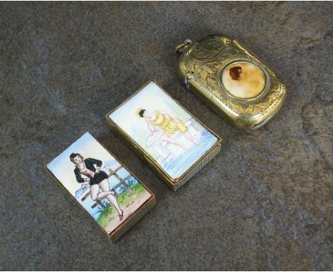 Two 19th century French brass and enamel vesta cases, each enamel cover depicting a woman, together with a further brass vest