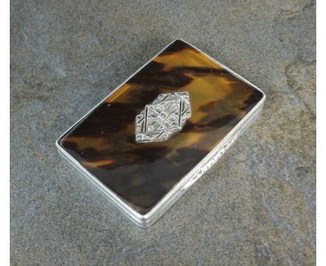 A silver and tortoiseshell box, import marks for Stockwell & Co, London 1928, of rectangular engine turned form, the tortoise