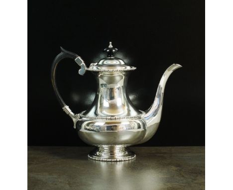 A silver coffee pot, Walker & Hall, Sheffield 1923, of baluster form with beaded band to body and rim, ebonised handle and fi