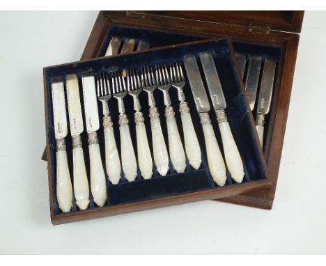 A cased part set of Victorian mother of pearl handled silver fruit knives and forks,Harrison Brothers & Howson, Sheffield 187