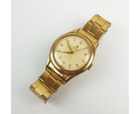 A Gentleman's 9ct gold Rolex Perpetual bracelet wristwatch, the white dial with gold Arabic numerals and sweep seconds hand, 