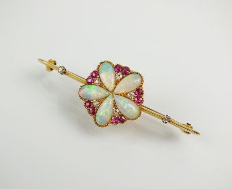 An opal, diamond and ruby cluster bar brooch, designed as a central pear shaped cabochon opal flower interspersed with old an