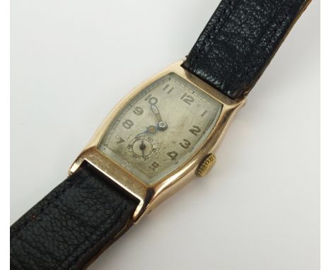 A Gentleman's 9ct gold Art Deco wristwatch, import mark for London 1927, the shaped rectangular silvered dial with Arabic num