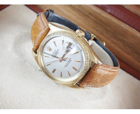 A Gentleman's 18ct gold Rolex Oyster Perpetual Datejust wristwatch, the silvered dial with gold batons, sweep seconds hand an