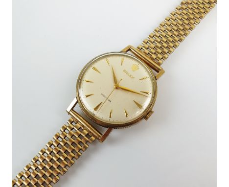 A Gentleman's 9ct gold Rolex Precision wristwatch, the silvered dial with gold batons, manual wind, reeded bezel and lugs, wi