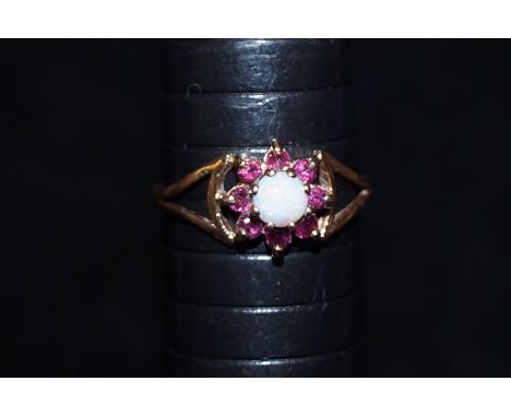 9 ct Gold dress ring set with ruby's &amp; central opal Size P