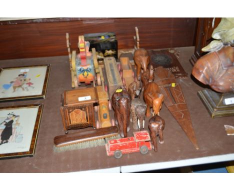 Various carved wooden animal ornaments; an expanding book rack; toys; vintage pencil case etc.