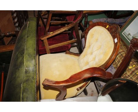 A Victorian walnut nursing chair with button back