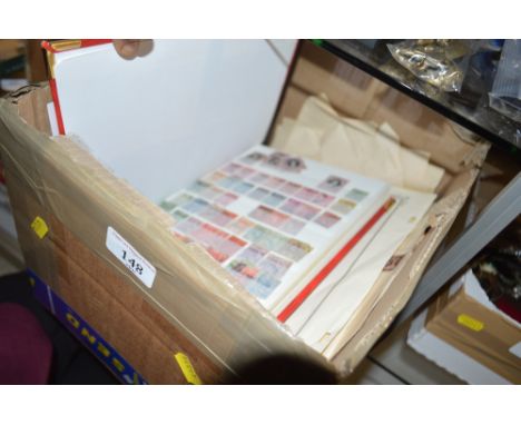 A box containing stamp stock book and Commonwealth stamps 