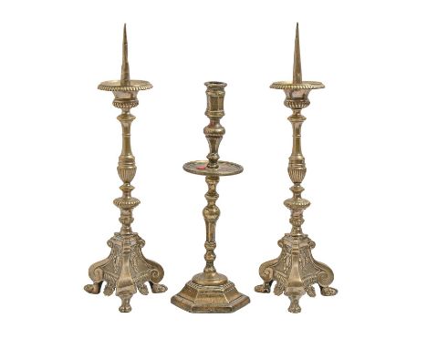A pair of cast brass pricket sticks, late 19th c, in Renaissance style, 50cm h and another contemporary candlestick,&nbsp; on