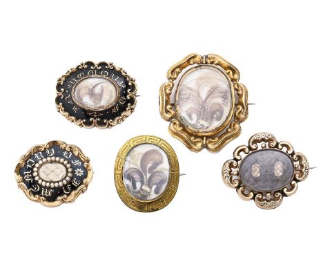 Five Victorian mourning brooches, of gold or giltmetal and enamel, all inset with hair, 57mm and smaller Good condition, or w
