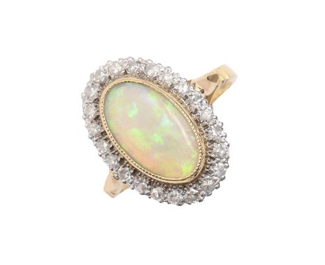 An opal and diamond ring, in 18ct gold, head 13 x 19mm, London 1981, 5.5g, size N  Good condition, opal with only one or two 