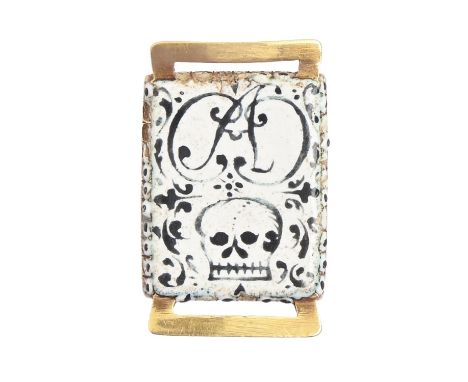 An English gold and enamel memento mori slide, early 18th c, inset with plaited hair, the reverse painted in black on white w