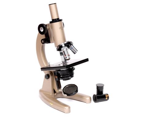 A compound microscope Prior England, No. 65431, mid 20th century, with eyepiece, triple objective nose piece, non metallic st
