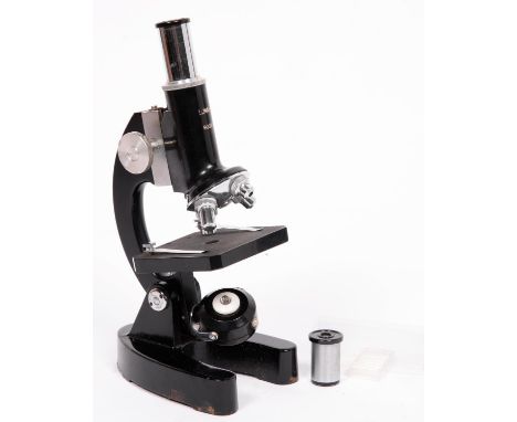 A compound student's microscope, Lunax 900X, 1960's/70's, with two eyepieces, four objective lenses, plano mirror/lamp bulb, 