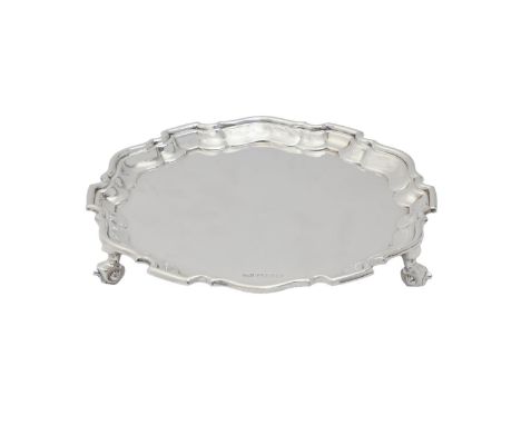 A George V silver salver, on three volute feet, 20cm diam, by Viners Ltd, Sheffield 1935, 10ozs 12dwts  No engraving, light p