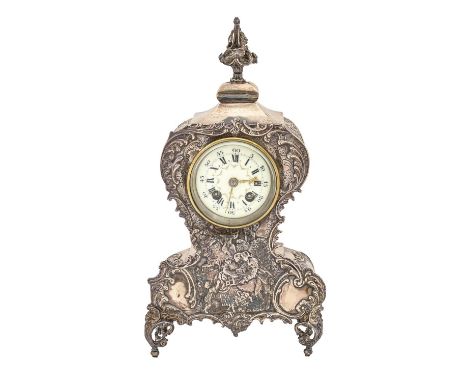 An Edwardian silver clock, with primrose enamel dial and French gong striking movement, the case stamped with mid 18th C scen