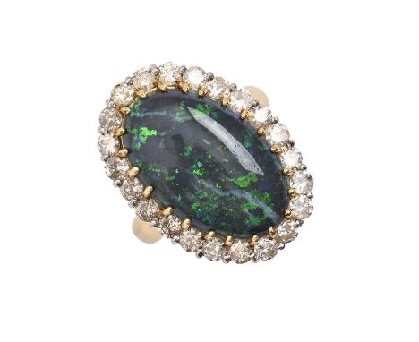 A black opal and diamond cluster ring, in gold marked 18ct, 17 x 24mm, 8.9g, size L  Opal with two fine hairline fractures ev