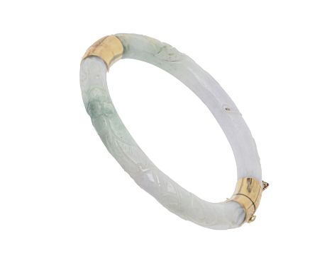 A gold mounted Chinese carved jadeite bangle, 20th c, with engraved mounts, 60mm (internal), marked CKG (incuse) 14K 585, 42.