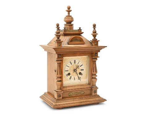 A German walnut mantel clock, early 20th c, with Junghans gong striking movement, pendulum, 45cm h  Good condition and workin