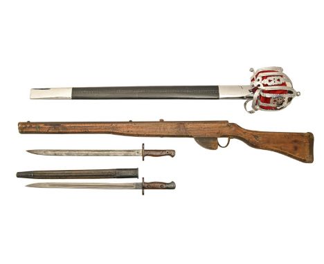 Two British P1907 sword bayonets and one leather scabbard, both marked WILKINSON, a wooden drill practice rifle and a reprodu